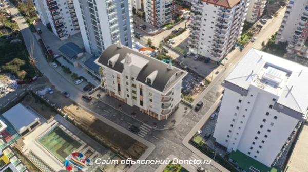 Новая двухкомнатная квартира на берегу моря в Турции по цене вторички